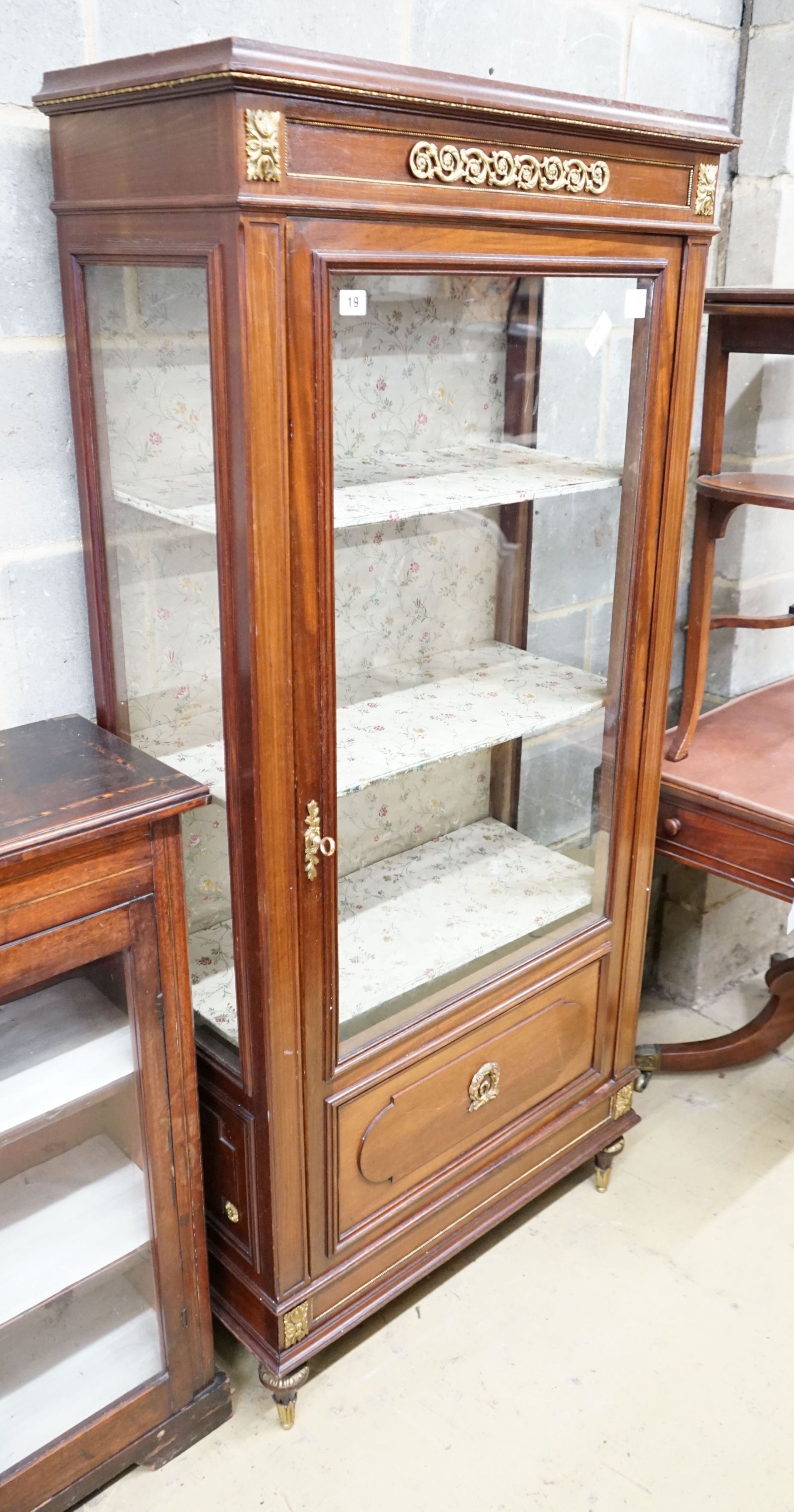 A French gilt metal mounted glazed mahogany vitrine, width 76cm, depth 35cm, height 163cm